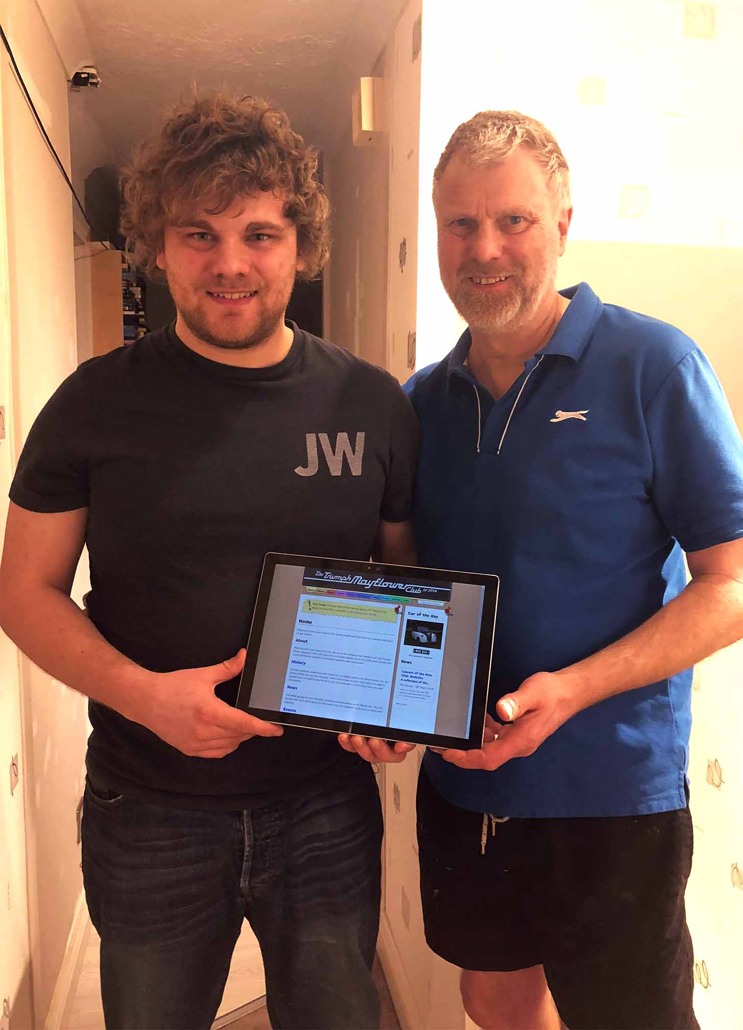 Photo of Rob and Andy Showing-off the Finished Website